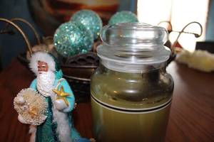 lot 592 image: Holiday Decor Set with Santa Figurine, Ornaments and Candle
