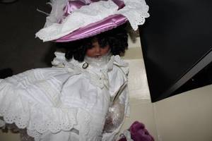 lot 667 image: Porcelain Doll with Victorian Outfit and Purple Teddy Bear