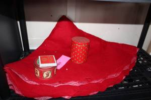 lot 676 image: Set of Holiday Decoration Tins, Playing Cards, and Pinecones