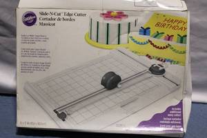 lot 38 image: Wilton Slide-N-Cut Cake Decorating Cutter Set