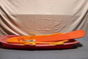 lot 54 image: Set of 3 Assorted Plastic Sleds with Dragon Design Board