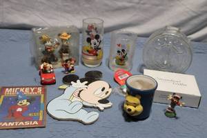 lot 79 image: Disney Mickey Mouse Collectible Set with Glasses, Figurines, and More