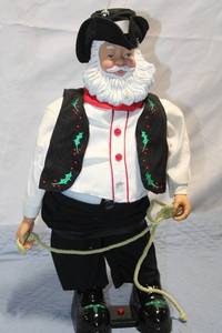 lot 354 image: Vintage Cowboy Santa Claus Figurine with Rope Accessory