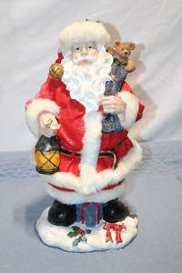 lot 355 image: Collectible Handcrafted Santa Claus Figurine with Lantern and Teddy Bear
