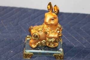 lot 1323 image: Golden Rabbit Figurine on Glass Base