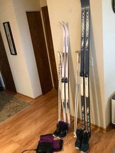 2 Sets of skis, boots and poles