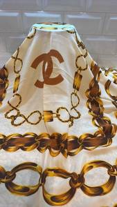 lot 55 image: Chanel Paris Silk Scarf with Chain and Medallion Design 33 x 35 Inches