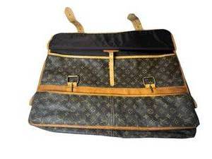 lot 77 image: Louis Vuitton Monogram Canvas Garment Bag with Leather Trim