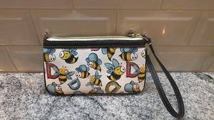 lot 6 image: Dooney & Bourke Bee Print Wristlet Pouch