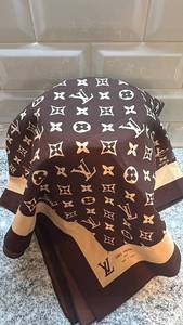 lot 29 image: Louis Vuitton Monogram Silk Scarf 34x32 Inches Brown Beige