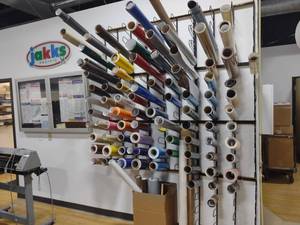 lot 25 image: Assorted Vinyl Rolls with Wall Rack...
