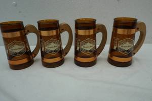 lot 198 image: 4 Grain Belt brown glass and copper mugs with wooden handles