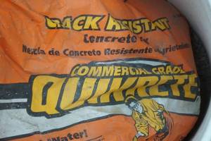 lot 239 image: partial bag of Quikrete