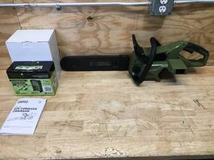 lot 6 image: Green Machine Cordless Chainsaw Model # GMCS6200