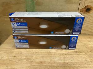 lot 79 image: GE Lot of 2 Packs of- 4 Watt Dimmable Modern Easy Linking Corded Electric Ceiling Mount Plastic 5,0000 Hour 3.1 Inch Diameter LED Puck Lights (5 puck lights per pack)