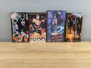 lot 41 image: Collection of 4 KISS Documentary VHS Tapes The Second Coming, KISS UnAuthorized, Hells Guardian, and KISS Meets the Phantom of the Park