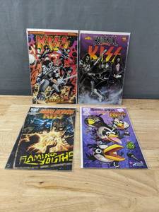 lot 115 image: Set of 4 KISS Comic Books Including Dynamite KISS Forever, IDW Mars Attacks KISS, Revolutionary Rock and Roll KISS and IDW Nuumber 1 Angry Birds Comics KISS Cover