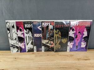 lot 147 image: 7 Total Comics KISS Vampirella Covers A-G Dynamite #3