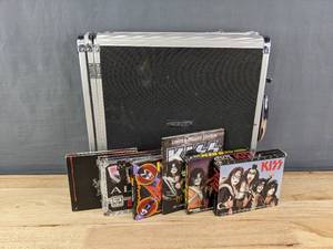 lot 102 image: Collection of KISS CDs with Vaultz CD Holder Monster Limited Deluxe Edition, Symphony Alive IV, Alive 1975-2000, Sonic Boom, 25th Anniversary Star Profile and The Low Down 2 Disc Biography Set
