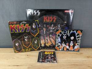 lot 119 image: New 450 Piece KISS Puzzle, KISS Pinball Playstation, KISS The Second Coming, New KISS Magnets