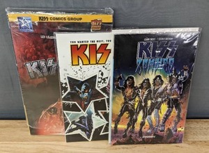 lot 180 image: KISS 4K Wetta Book, KISS Zombies Dynamite Comic Book and KISS Solo IDW Comic Book