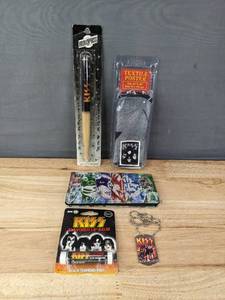 lot 194 image: KISS Drumstick Pen, Lip Balm, Necklace, Wallet and Textile Poster 30 x 40