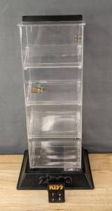 lot 167 image: Kiss Band Solo Albums Rock & Roll 2005 Catalog Butane Lighter and Zippo Display Case