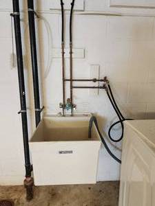 lot 28 image: Utility Sink and Faucet