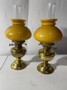lot 33 image: Vintage Brass Oil Lamps Pair Amber Glass Shades