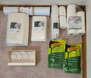 lot 299 image: Collection of Vacuum Sealer Bags, Rolls, Tree Staking Kits, and Cheese Markers - quantities unverified