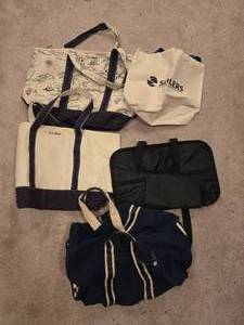 lot 382 image: Collection of Branded Tote Bags and a Suit Carrier