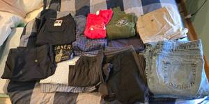 lot 394 image: Assorted Adult Clothing Collection - Jeans, Shorts, and Shirts