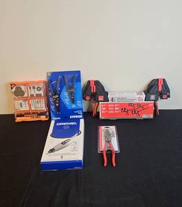 lot 139 image: Assorted Tool Collection with Dremel, Pliers, and Clamps