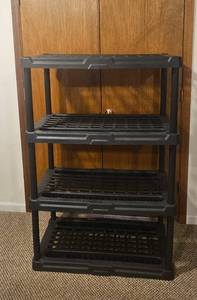 lot 259 image: 4-Tier Black Plastic Storage Shelving Unit