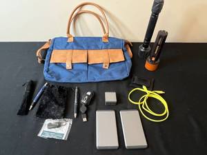 lot 232 image: Electronics and Accessories Collection with Flashlights, Power Banks, and Travel Bag