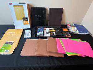 lot 338 image: Collection of Office Supplies and Phone Accessories Including Envelopes, Notebooks, and Screen Protectors