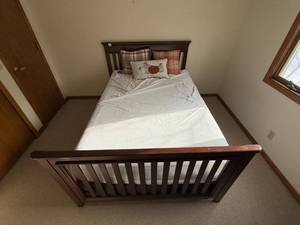 lot 156 image: Full-Size Wooden Bed Frame with Plush Pillows