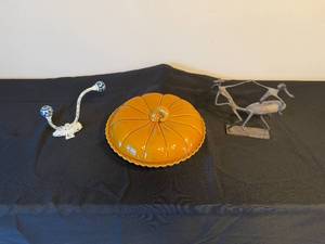 lot 176 image: Set of Home Decor Items Ceramic Pie Dish, Rustic Metal Figurine, and Decorative Hook