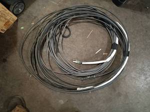 lot 83 image: Large roll of rooftop electric ice melt cable.