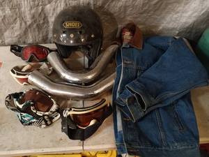 lot 12 image: Helmet, Ski goggles, Motorcycle exhaust pieces, Denim Jacket