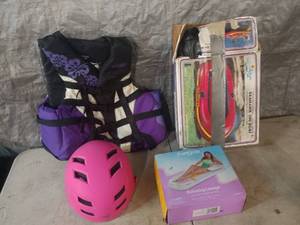 lot 16 image: USCG Approved Life Jacket (Size Ladies Large) , Helmet, and Inflatable Rafts