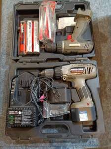 lot 107 image: Cordless drill wbattery & charger, and paslode fuel cartridges