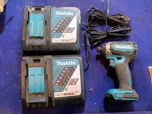 lot 109 image: Makita 14 impact driver and 2 battery chargers