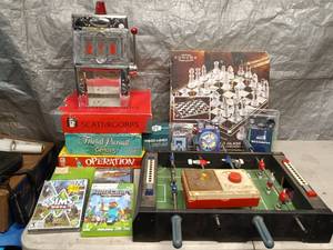 lot 119 image: Mini foosball table, board games, slot machine that pours shots and misc. video games