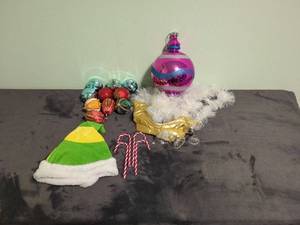 Assorted Holiday Decorations Including Ornaments and Elf Hat