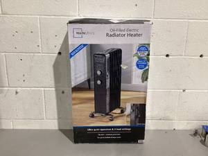 lot 561 image: Mainstays Mechanical Oil Filled Electric Radiator Space Heater, Black