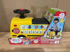 lot 427 image: CoComelon School Bus Ride-on with Letters, Numbers, & Music