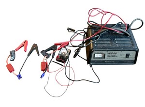 lot 236 image: Schumacher Battery Charger 103050 AMP 12 volt, Analog Multimeter and More