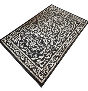 lot 58 image: Black and Cream Throw Rug