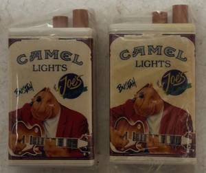 lot 29 image: (2) Camel Lights Metal Match - Joes Place  Bustah & (2) Camel Metal Matches Boxes